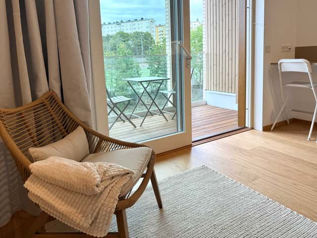 Modern studio interior in Kungsholmen, private balcony for coffees, large courtyard space