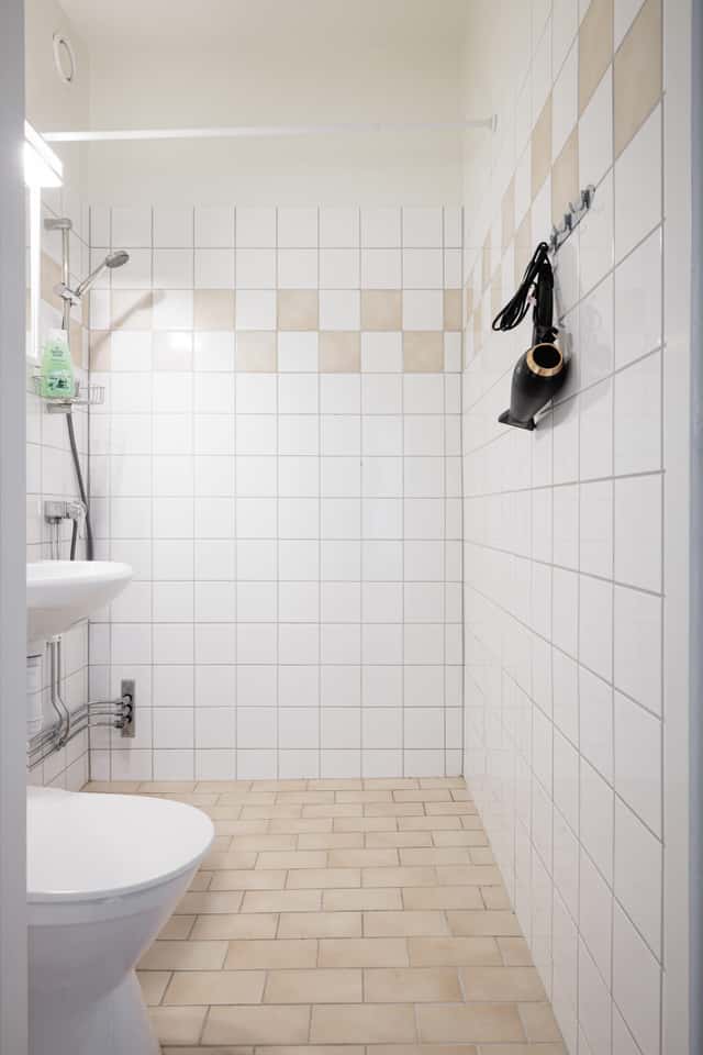 Studio apartment interior, kitchenette, cozy living area, local cafés and shops nearby, Sundbyberg