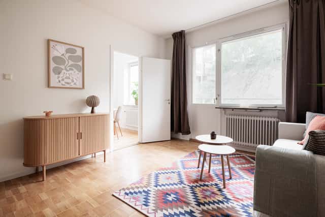 Studio apartment interior, kitchenette, cozy living area, local cafés and shops nearby, Sundbyberg