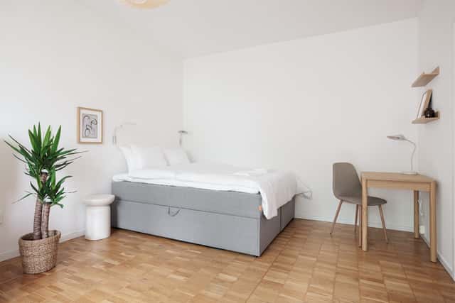 Studio apartment interior, kitchenette, cozy living area, local cafés and shops nearby, Sundbyberg