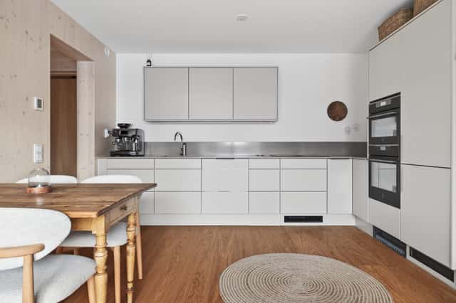 Interior of a light-filled Kungsholmen apartment in Scandinavian style with wooden details