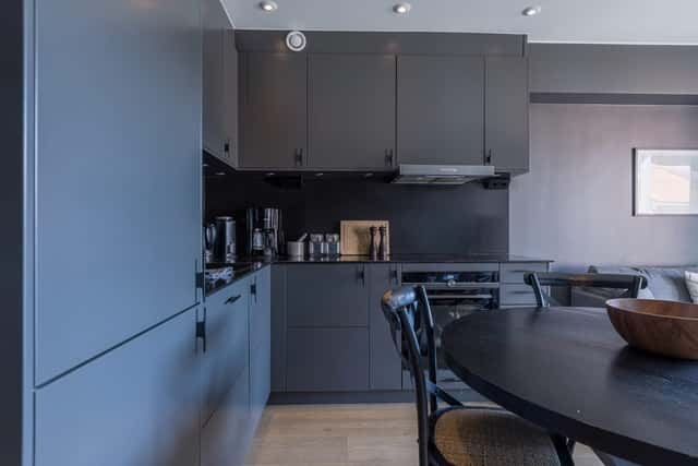 Modern kitchen in Åre apartment, stylish bathroom interior, cozy living area with mountain view