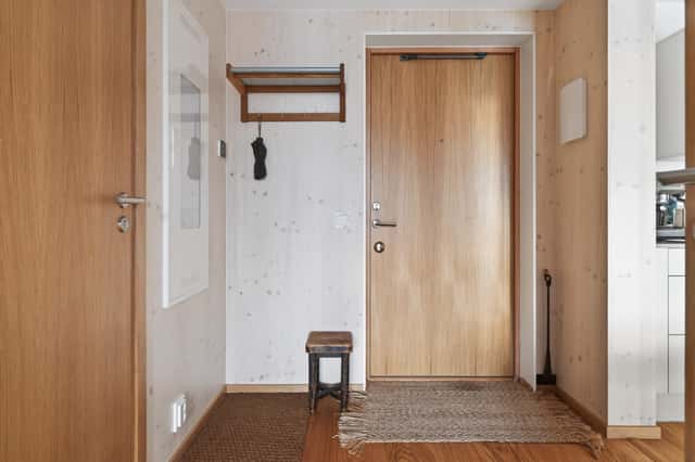Interior of a light-filled Kungsholmen apartment in Scandinavian style with wooden details