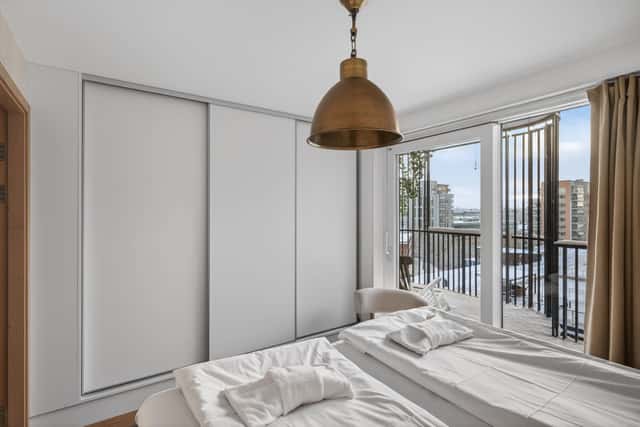 Interior of a light-filled Kungsholmen apartment in Scandinavian style with wooden details