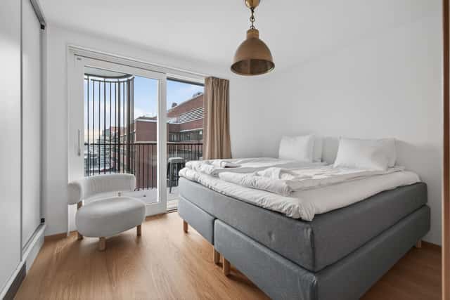 Interior of a light-filled Kungsholmen apartment in Scandinavian style with wooden details