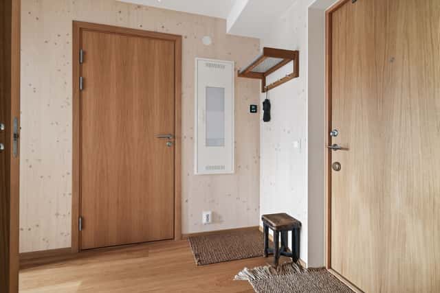 Interior of a light-filled Kungsholmen apartment in Scandinavian style with wooden details