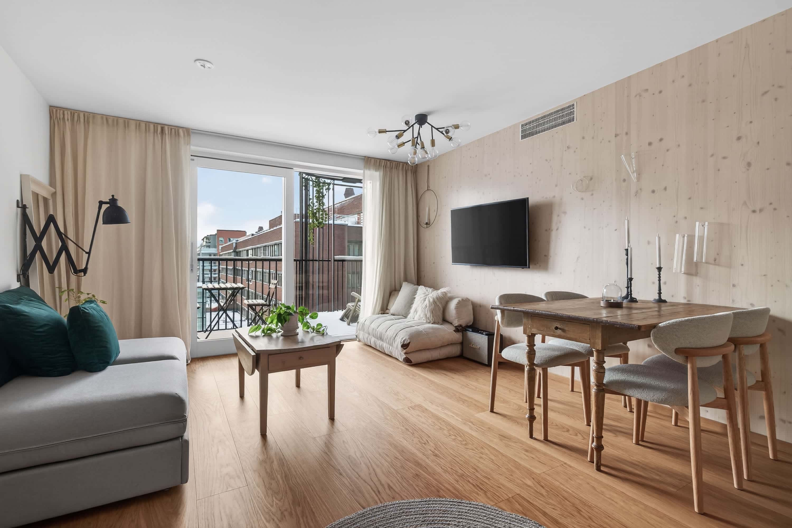 Interior of a light-filled Kungsholmen apartment in Scandinavian style with wooden details