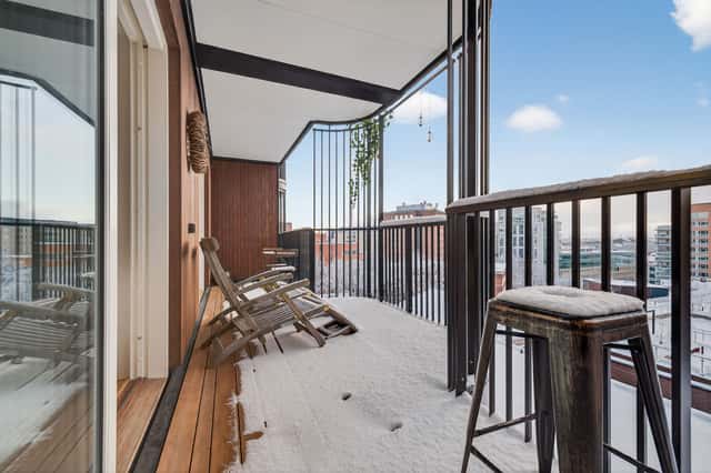 Interior of a light-filled Kungsholmen apartment in Scandinavian style with wooden details