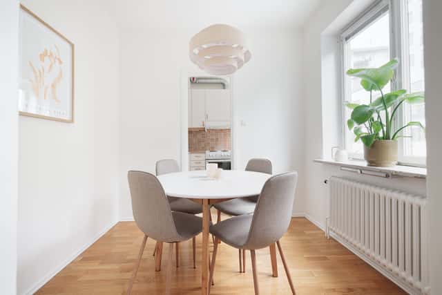 Studio apartment interior, kitchenette, cozy living area, local cafés and shops nearby, Sundbyberg