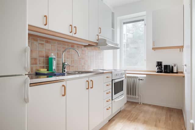 Studio apartment interior, kitchenette, cozy living area, local cafés and shops nearby, Sundbyberg
