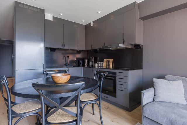 Modern kitchen in Åre apartment, stylish bathroom interior, cozy living area with mountain view