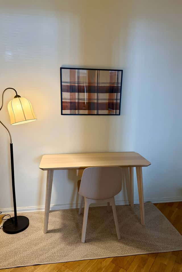 Södermalm studio interior, cozy living area by the water, modern kitchenette, café-lined streets nearby
