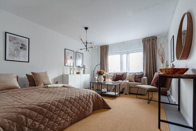 Living room with sofa bed in Södermalm studio apartment.