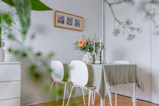 Comfortable living room with balcony access in Globen apartment