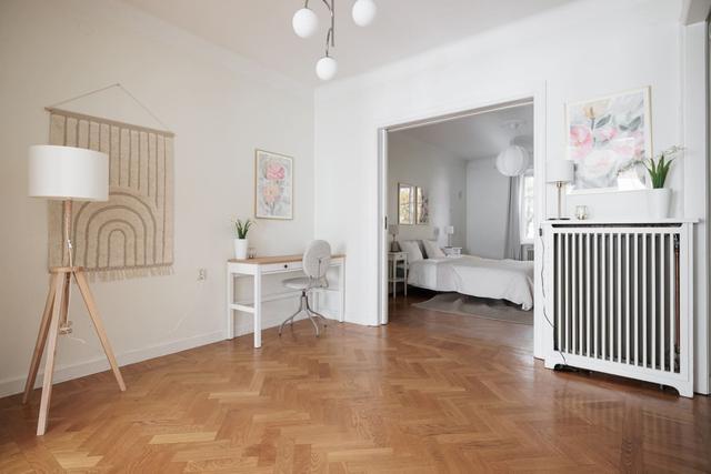 Living room in Vasastan apartment with large windows