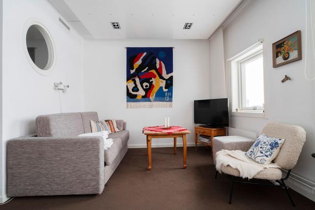 Living room in Åre apartment with sofa bed and mountain view.