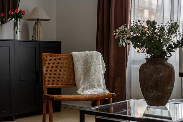 Living room with dining table and sofa bed in Södermalm apartment.