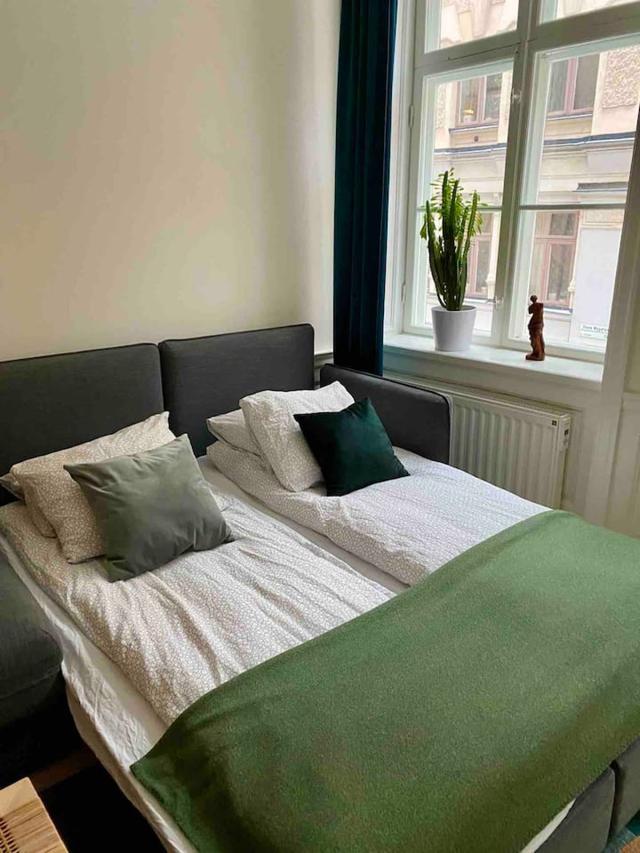 Cozy master bedroom with antique fireplace in Stockholm Old Town