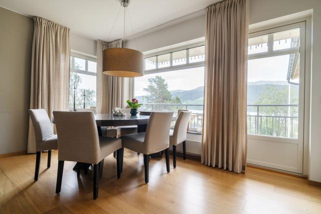 Dining area with stunning lake and mountain views in Åre