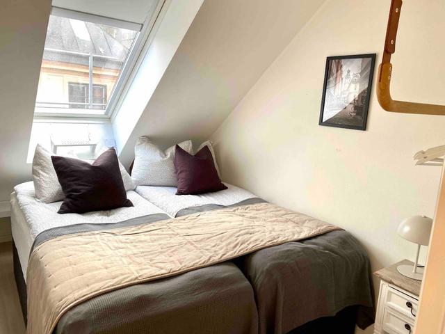 Bright attic apartment in Old Town Stockholm with modern design.