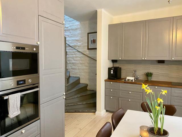 Loft apartment in Stockholm's Old Town with wooden beams.