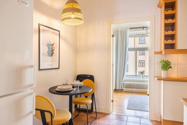 Living room with a convertible sofa in central Gothenburg apartment.