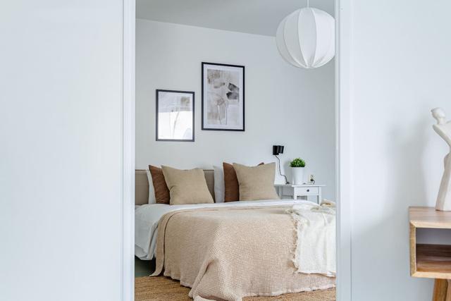 Living room with sofa bed and office space in Södermalm apartment