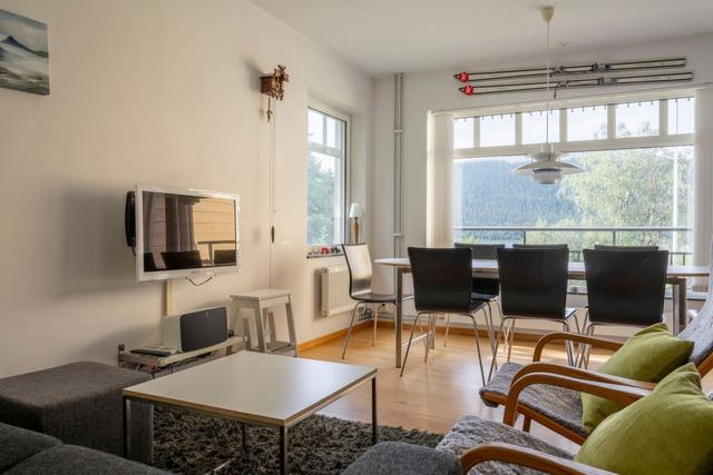 Spacious kitchen in Åre apartment with balcony access