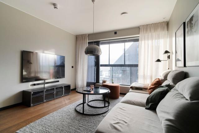 Living room in central Åre apartment with large windows