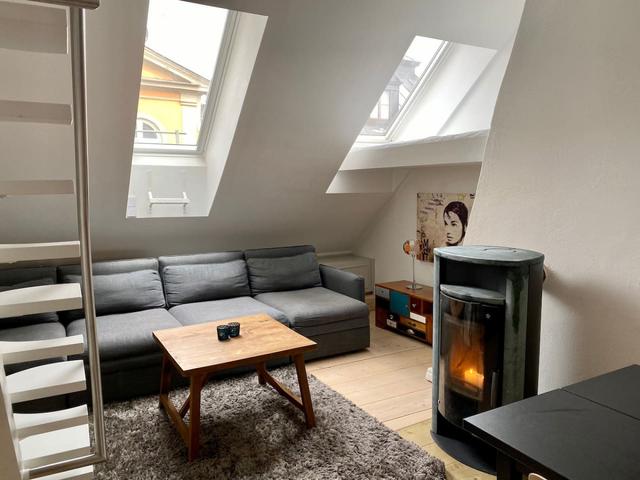 Rooftop apartment living room in Old Town Stockholm