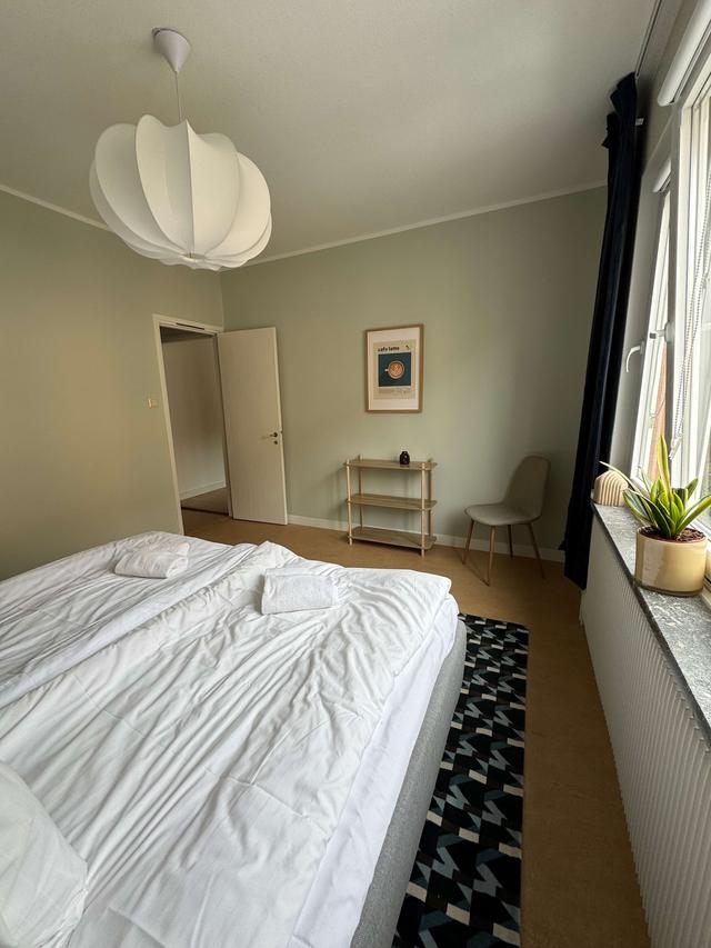Cozy one-bedroom apartment interior in Sundbyberg with workspace and separate kitchen