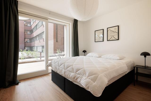 Modern Kungsholmen apartment interior and private patio.