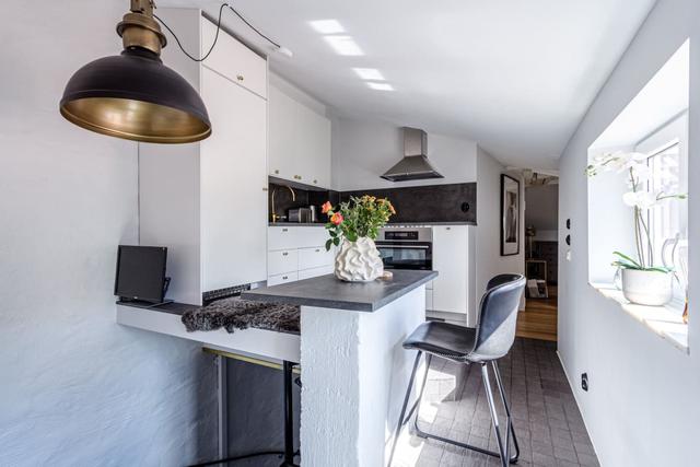 Top-floor apartment in Södermalm with city views and modern amenities.