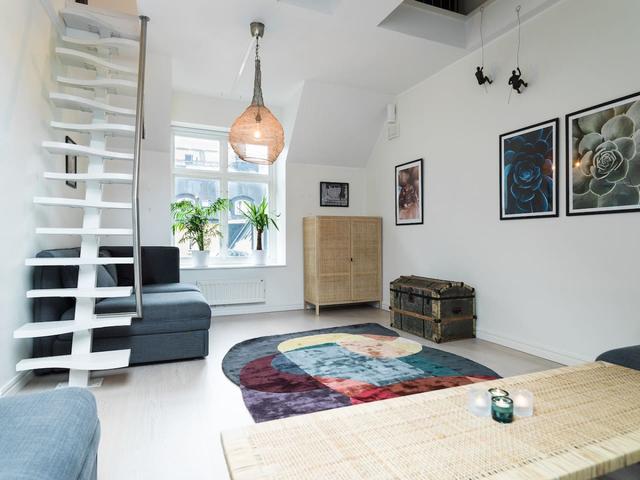 Bright attic apartment in Old Town Stockholm with modern design.