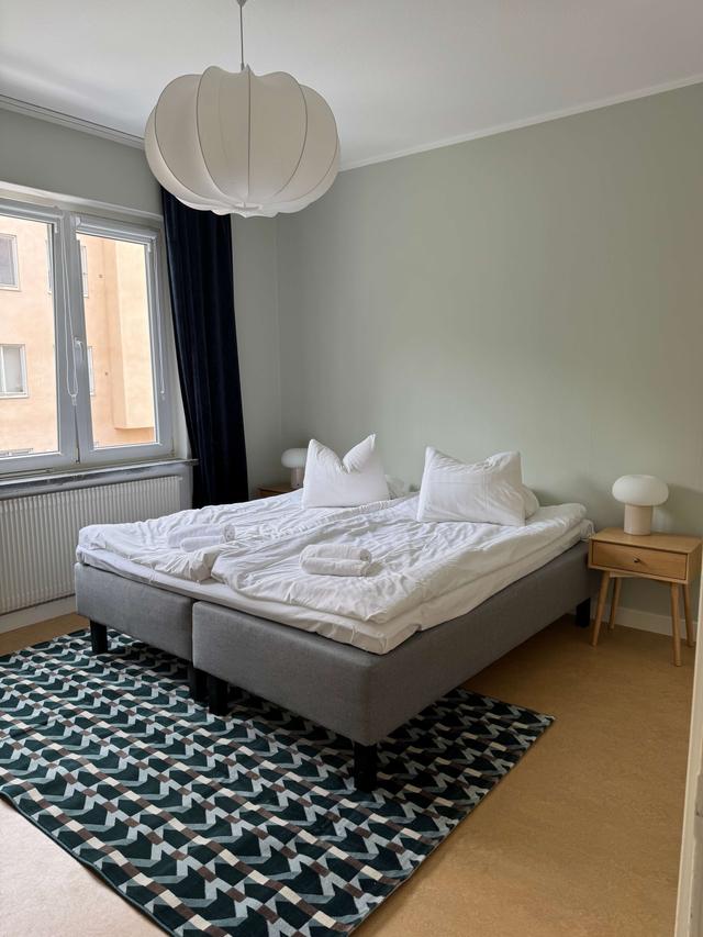 Cozy one-bedroom apartment interior in Sundbyberg with workspace and separate kitchen