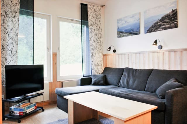 Familjelägenhet för skidsemester i Björnen med bastu, tre badrum och skidförråd nära skiduthyrning