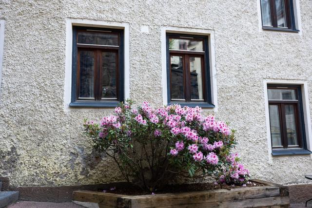 Cozy dining area for two by the large window in Gothenburg.