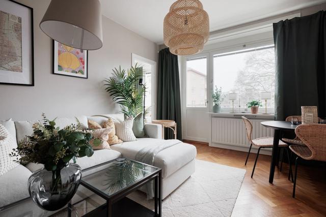 Spacious and bright living area in Stockholm apartment.