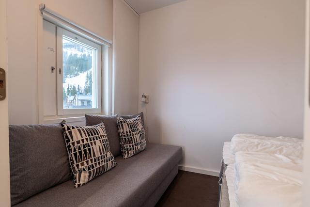 Living room with kitchenette and dining area, Åre apartment.