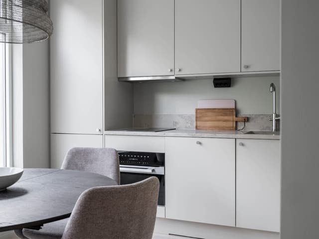 Exterior of ski-in, ski-out apartment in Åre, cozy living room, modern kitchen, bathroom, mountain trail access