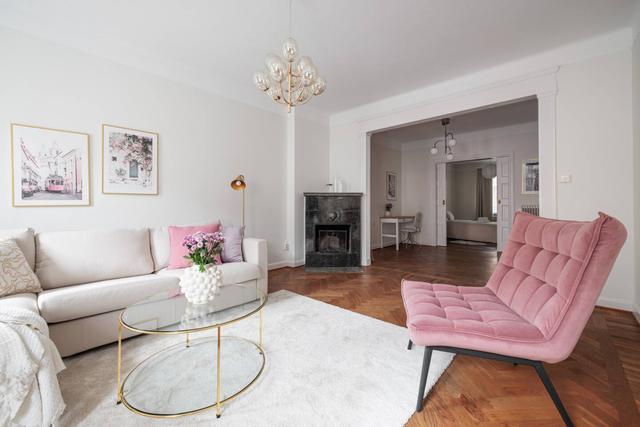 Third-floor living room with large windows in Vasastan