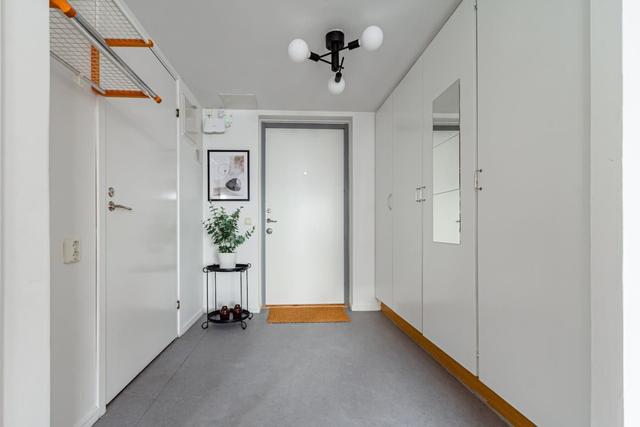 Living room with sofa bed in Södermalm studio apartment.