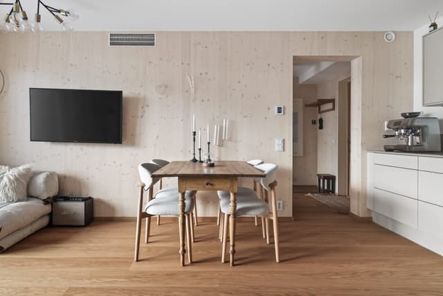 Interior of a light-filled Kungsholmen apartment in Scandinavian style with wooden details