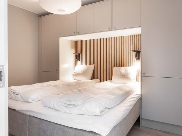 Exterior of ski-in, ski-out apartment in Åre, cozy living room, modern kitchen, bathroom, mountain trail access