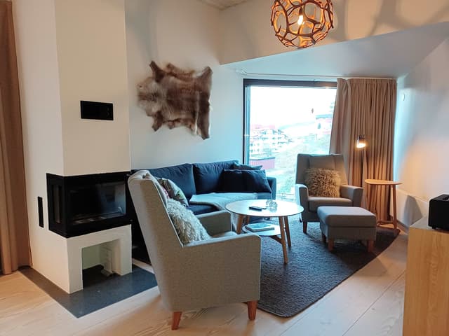 Modern apartment in Åre near the square with fireplace, private sauna, balcony and easy access to ski lifts.