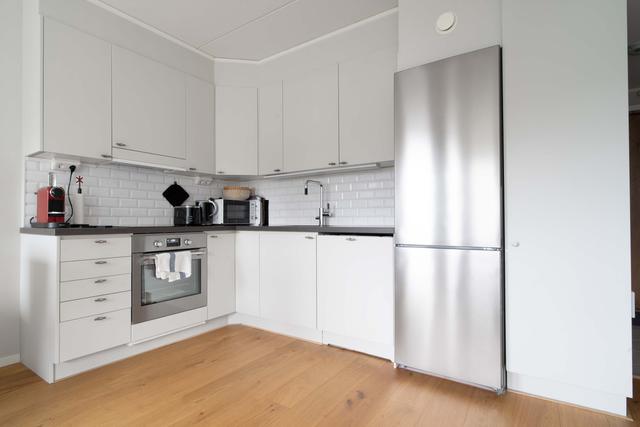 Cozy living room in Åre apartment, modern dining area and kitchen, master bedroom and second bedroom