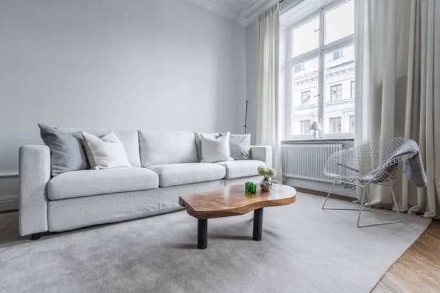 Renovated apartment in Östermalm, Stockholm with balcony and herringbone flooring.