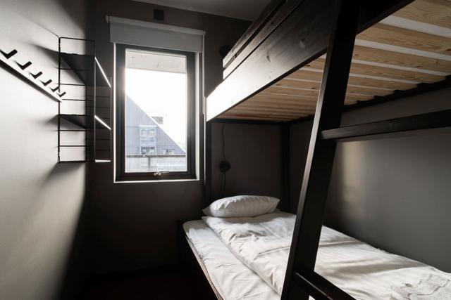 Living room in central Åre apartment with large windows