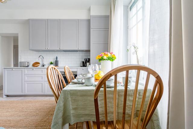 Bright open area combining kitchen and living room in chic apartment