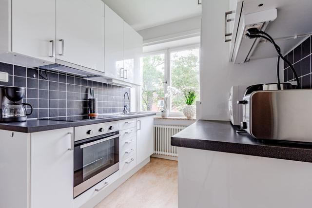 Living room with dining area in Sundbyberg